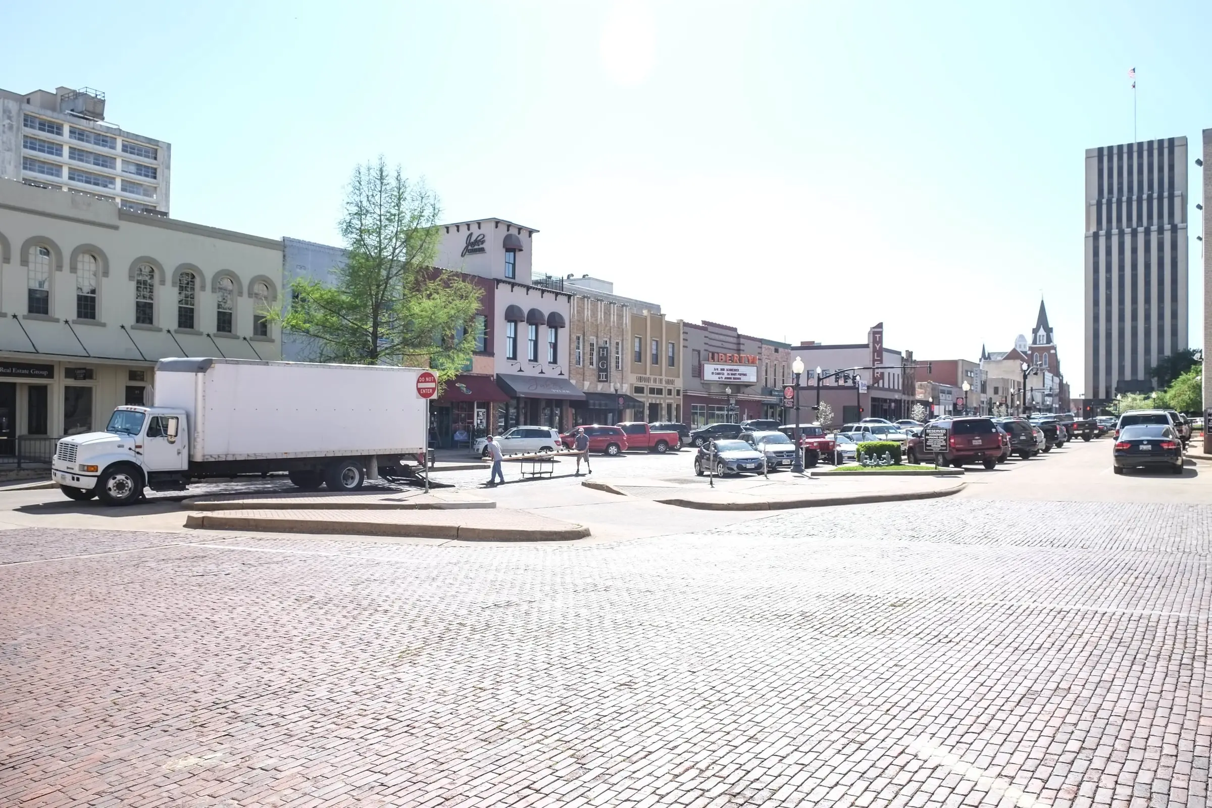 Brick paving and storefronts on the downtown square